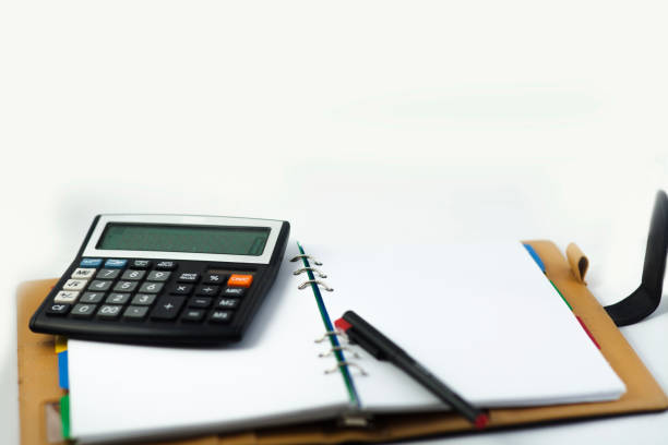 istock Financial notebook and pen isolated on a white background 1598650436