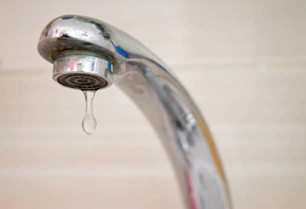 istock Drops of water falling down from the crane 1598672760
