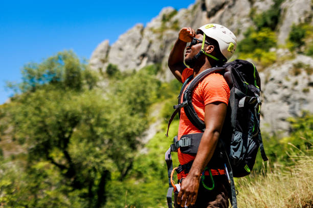 Cheerful hiker enjoys view in the mountains