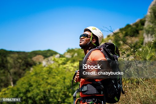 istock Male hiker enjoys nature 1598678141