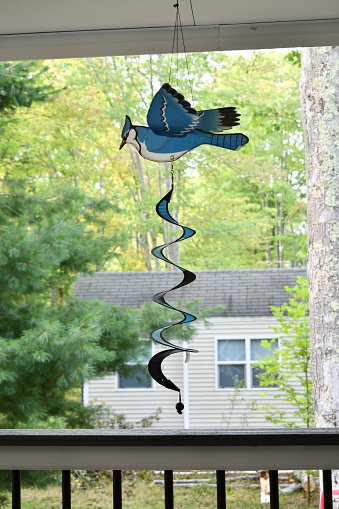 A blue jay wind spinner