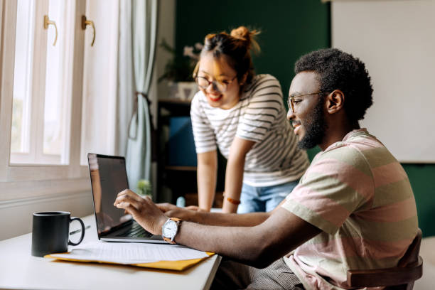 istock Two young colleagues working together at the office 1598681465