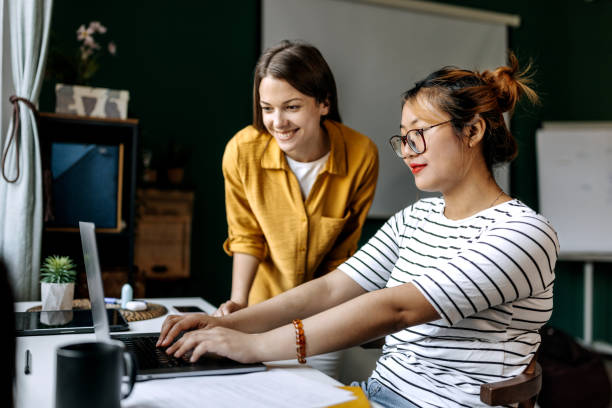 istock Two female colleagues working together at modern office 1598682049