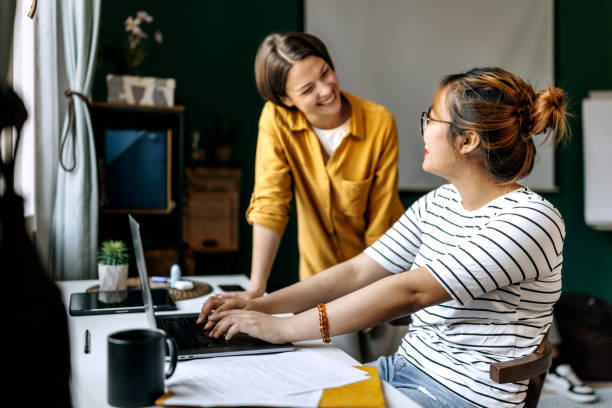 istock Two female colleagues working together at modern office 1598682310