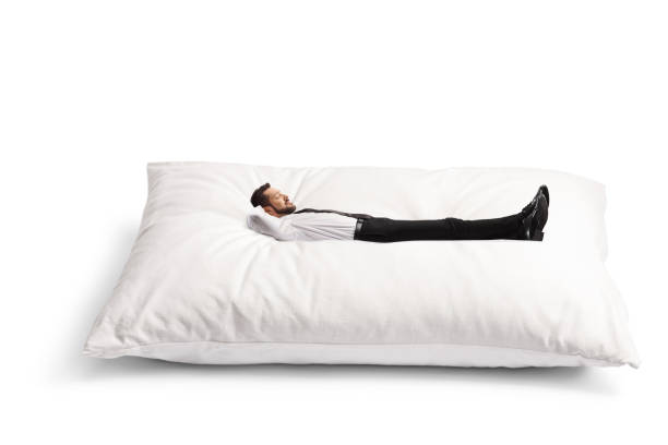 istock Businessman lying on a big pillow 1598683688