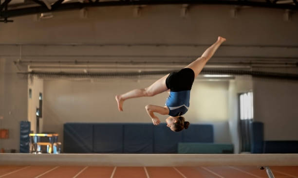 istock Gymnast woman practising on balance beam 1598710865