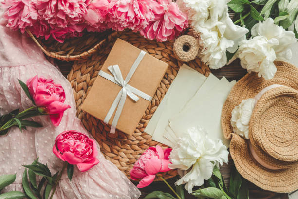 istock Gift box with bow and pink peonies, holiday concept 1598711418