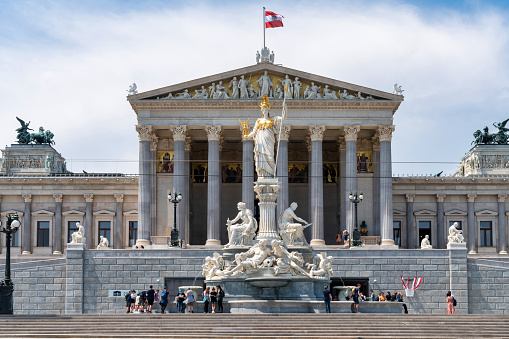 Vienna, Austria - October 06, 2021: Magnificent cascading fountains and sumptuous marble antique statues in the park of the Belvedere Palace in Vienna, the capital of Austria. Autumn rainy weather in Europe. Popular tourist and historical attraction, baroque architecture