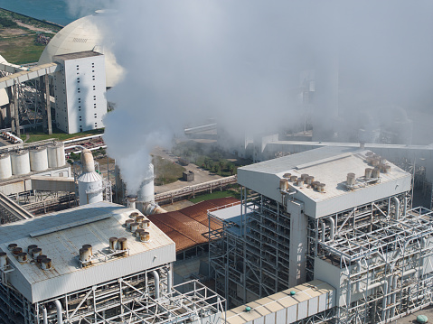 The smoky chimneys of the factory pollute the environment. In winter, smoke comes from the company's chimney.