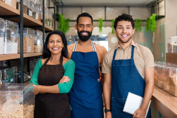 istock Sales team smiling for portrait at store 1598752715