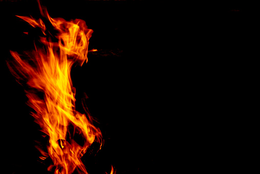 Flame fire on a dark background.