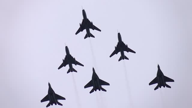 Six Fighter Jets Flying in Formation Against a Blue Sky in slow motion 120fps