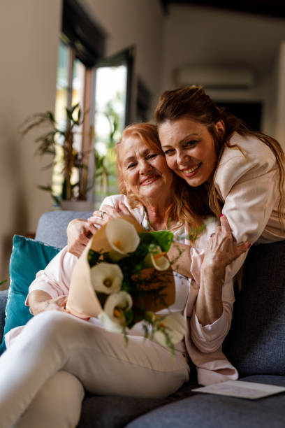 istock Embraced mother and daughter smiling at camera 1598814110