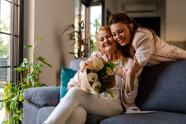 istock Embraced mother and daughter smiling at camera 1598814111