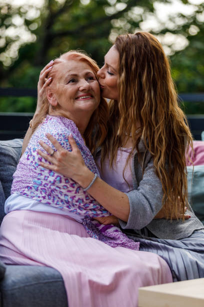 istock Affectionate woman cuddling her loving mother, having a bonding moment 1598817493