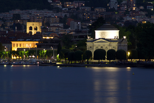 Romantic and charming lakeside of Como with historic buildings illuminated by the moon