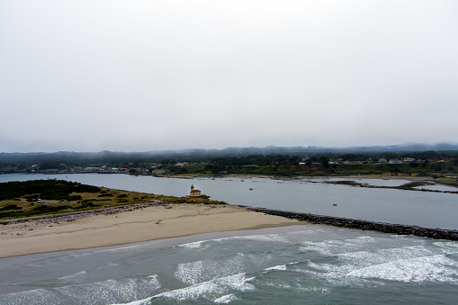 Aerial view Coquille River Lighthouse on the Oregon Coast near Bandon beach.