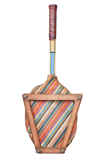 Vintage wooden tennis racket with colorful striped sleeve and rack isolated on a white background