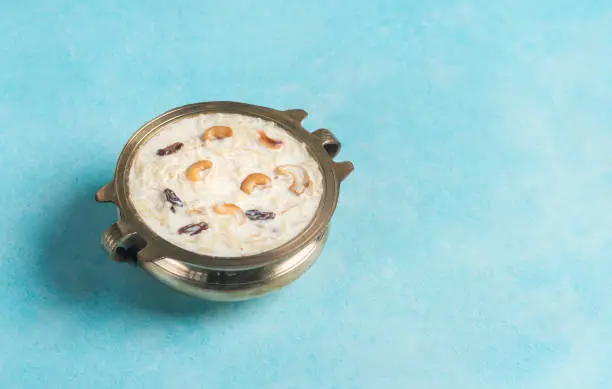 Semiya payasam isolated on blue colour background with copy space, Onam special dessert vermicelli kheer payasam