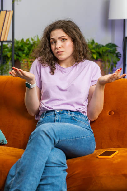 istock Confused young woman feeling embarrassed about ambiguous question, having doubts, no idea, no answer 1598826039