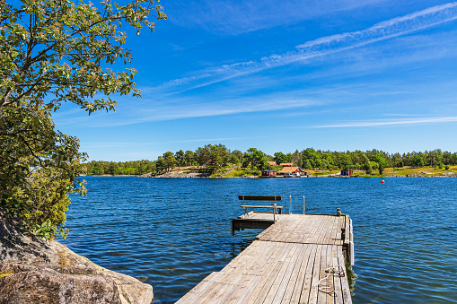 Landscape with rocks and landing stage on the island Slado in Sweden.