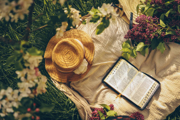 istock Open bible in the garden, christian concept 1598832179