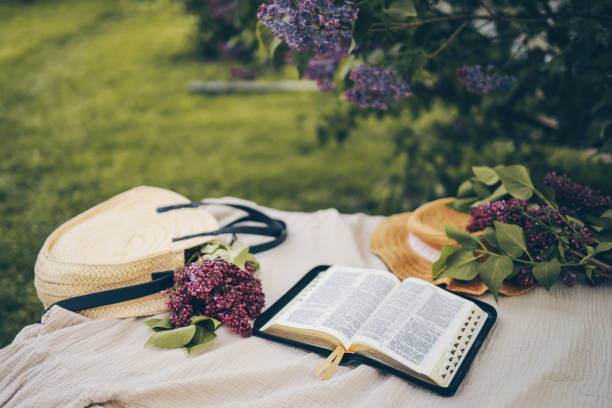 istock Open bible in the garden, christian concept 1598832183
