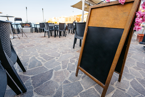 Outdoor plain chalkboard menu in Gozo Island, Malta.