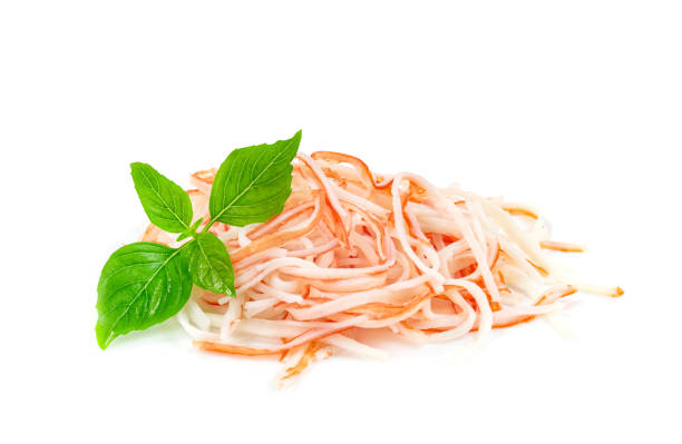 crab sticks noodles with basil leaves isolated on white background