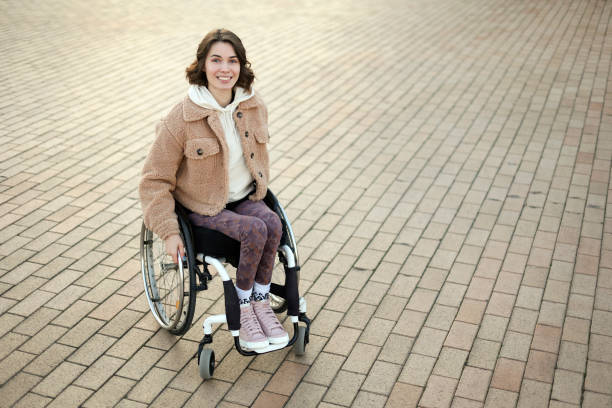 Young woman in a wheelchair stock photo