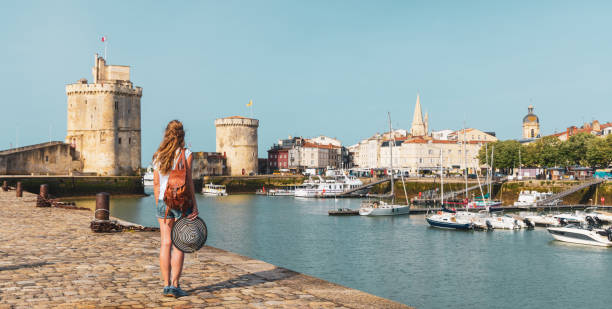Woman traveling in France,  La Rochelle,  South west France, Nouvelle Aquitaine stock photo