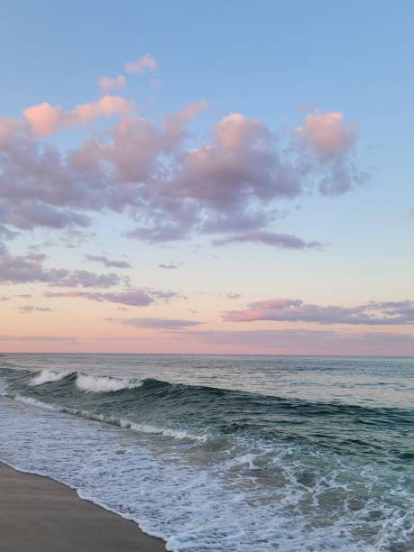 istock Seaside Park waves and pink clouds 1598843644
