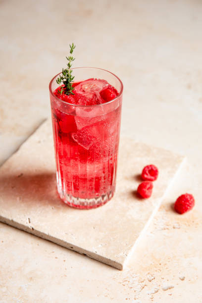 istock Red Raspberry Gin Cocktail Longdrink Lemonade Soda Drink with Berries and Thyme on bright kitchen counter 1598856935