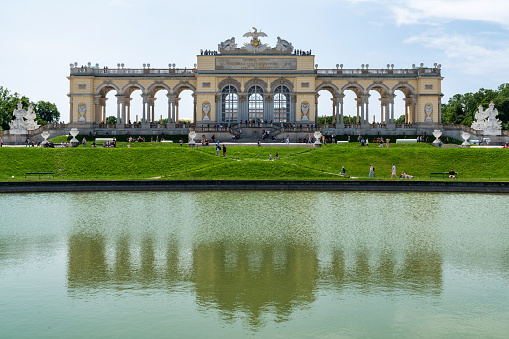 Rose Park with Regency Building in Bad Kissingen. The Regentenbau is a landmark of the spa town of Bad Kissingen. Built according to the plans of the Munich architect Max Littmann in the architectural style of neoclassicism, the event building was inaugurated in 1913. The Rose Garden is a public park and is located in the center of Bad Kissingen along the Franconian Saale. The Rose Garden was inaugurated in 1913, the same year as the Regentenbau. On June 26, 2016, the Rose Garden was reopened after seven months of general renovation with new extensive technology for the fountain. The Balthasar Neumann Promenade can be seen in the background.