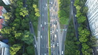 istock UAV aerial view of Shenzhen urban main road, lush green roadside trees and busy traffic on both sides of the main road. Shenzhen, Guangdong Province, China 1598878146