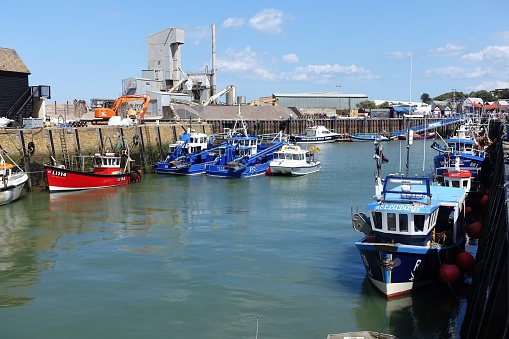 Whitstable, Kent, England, UK - 29th July 2023: Moored fishing boats in Whitstable harbour
