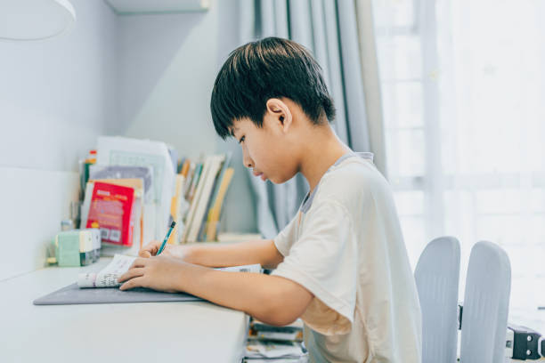 istock The boy is doing homework at home 1598928055