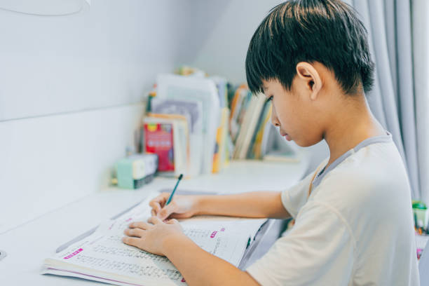 istock The boy is doing homework at home 1598928629
