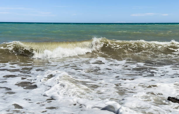 istock Beach shore. Waves at sea. Waves at sea during storm and wind. 1598933186