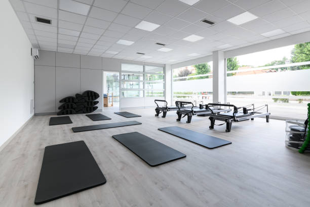 istock Pilates studio gym with mats, reformers and Pilates arcs 1598933778
