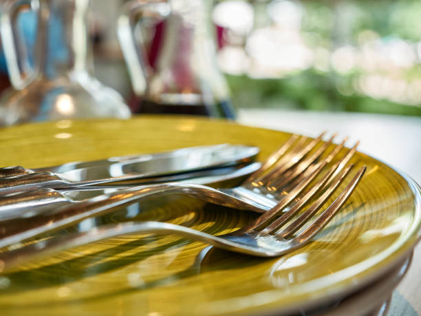 istock On the table is a plate with forks and cutlery. 1598934313
