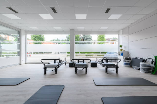 istock Pilates studio gym with mats, reformers and Pilates arcs 1598934909