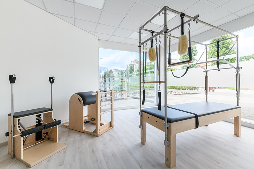 Pilates studio gym with Ladder Barrel, Trapeze Table and Combo Chair