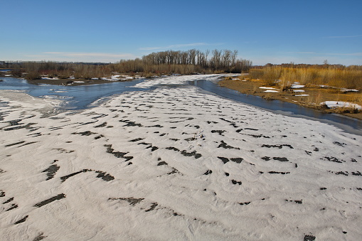 Russia, South of Western Siberia. Spring view of the last ice on the small flat rivers of Kuzbass.