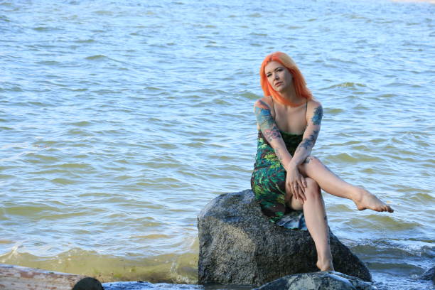 istock Sitting By The Sea Shore 1598954687
