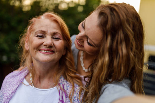 istock Woman taking selfies with her loving mother 1598964373