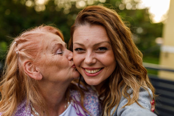 istock Woman taking selfies with her loving mother 1598964376