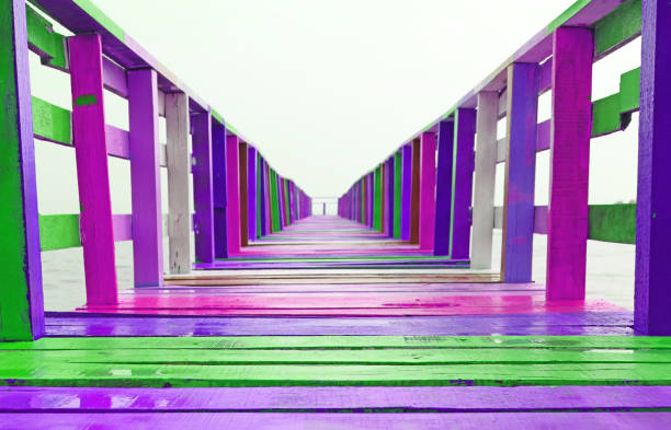 istock Diminishing Perspective of Multi Colored Pier Bridge after the Rain 1598991452