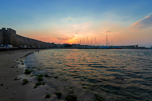 Mandraki port in Rhodes Town, Greece, and St Nicholas fortress in the background, UNESCO World Heritage Site, Rhodes City