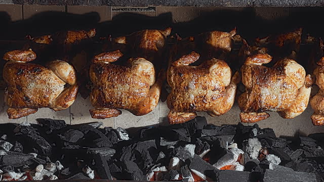 Peruvian food rotisserie chicken grill rotating
